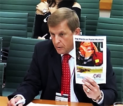 Pic: Dave Joyce holds up latest edityion of CWUv  REport into Dog bites