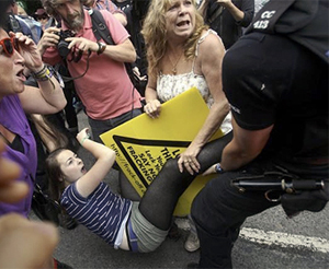 Pic: Police manhandle child at demonstration against Shale Gas drilling