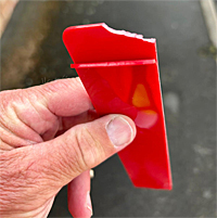 image: damaged postal peg by a dog bite